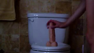 Wife rides her big toy on the toliet
