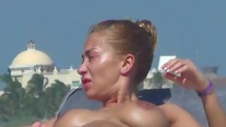 Wondrous  woman topless beach sunbathing