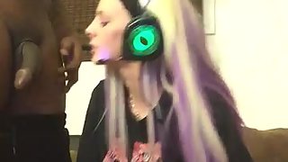 Blonde first-timer girl sucks a black cock while playing video games