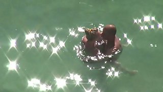 Hidden cam wife couple having sex in the sea gams wrapped around him