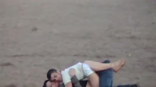 Young lovers making out on the beach hidden cam sex gauze lengthy lens camera