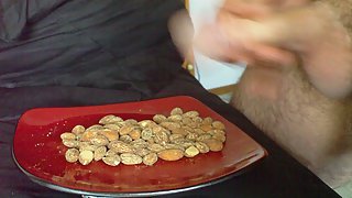 Shooting my load on a plate of nuts for a girls party