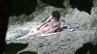 Voyeur camera seizing couple on beach having sex in public